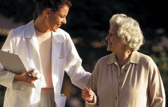 Rehabilitation nurse with patient